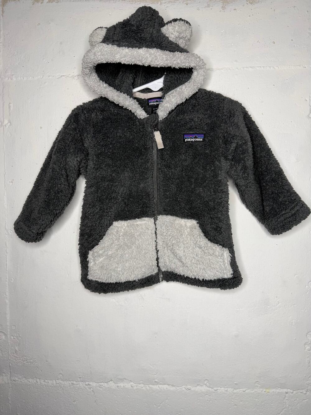 Patagonia 6-12  dark gray fleece featuring playful bear ears on the hood